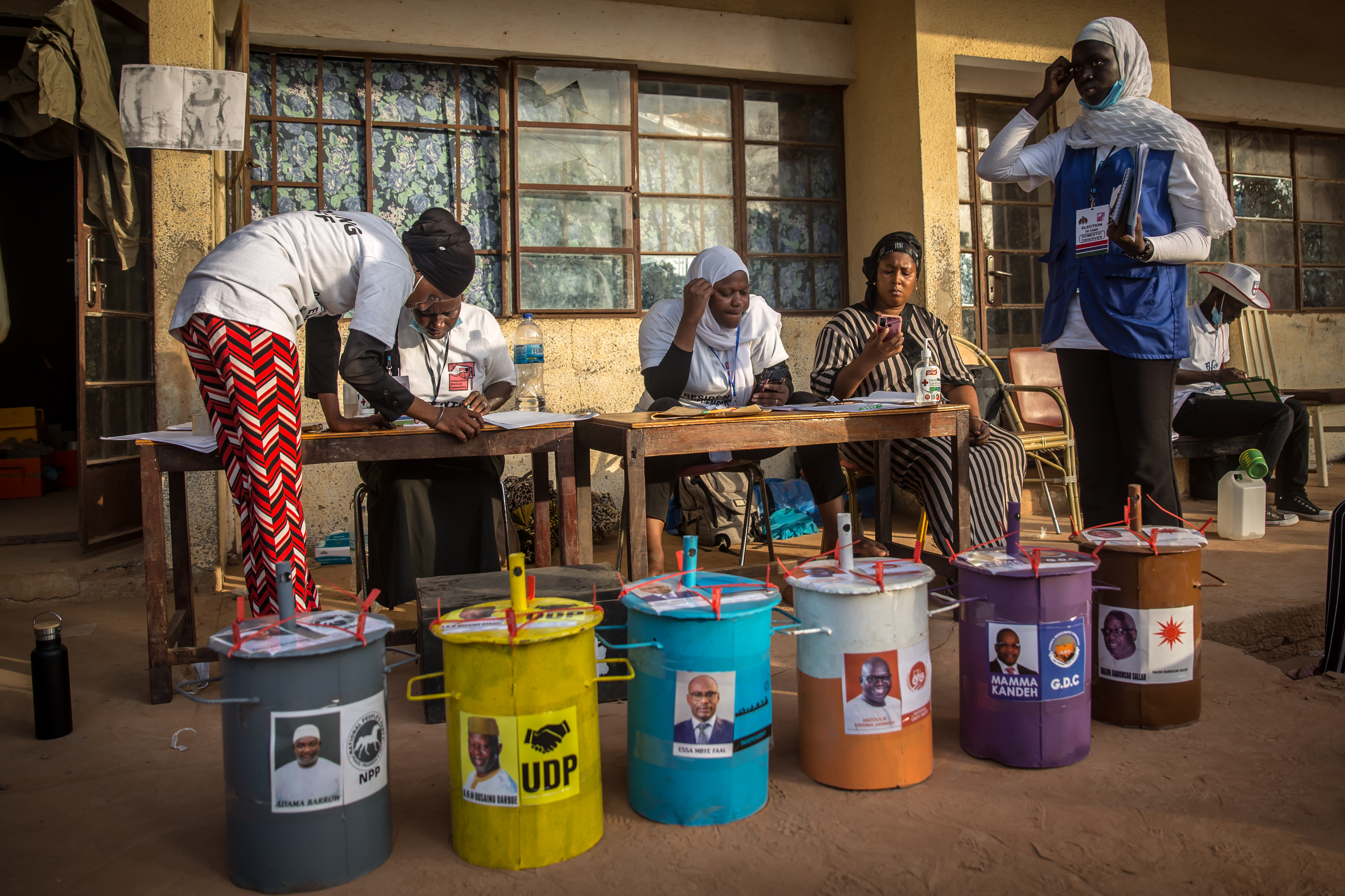 Officials at a polling station prepare to count votes in The Gambia’s presidential election (2021). This was the first presidential election in The Gambia since the long-standing dictator Yahya Jammeh was ousted from power in 2017. Credit: Sally Hayden / SOPA Images/Sipa USA